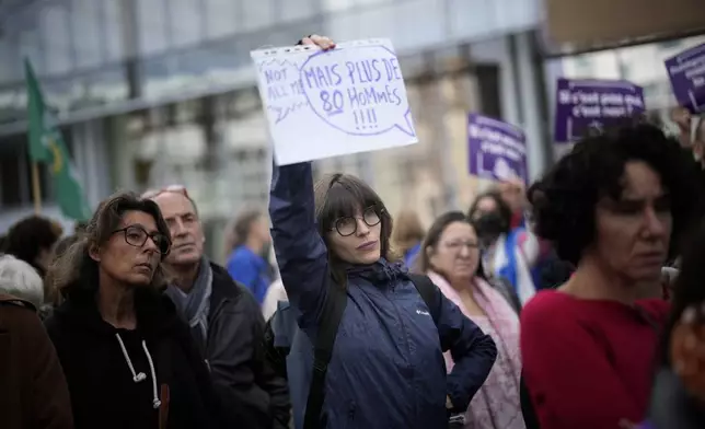 People gather to take part in a protest against sexual violence, in Paris, France, Saturday, Oct. 19, 2024. (AP Photo/Christophe Ena)