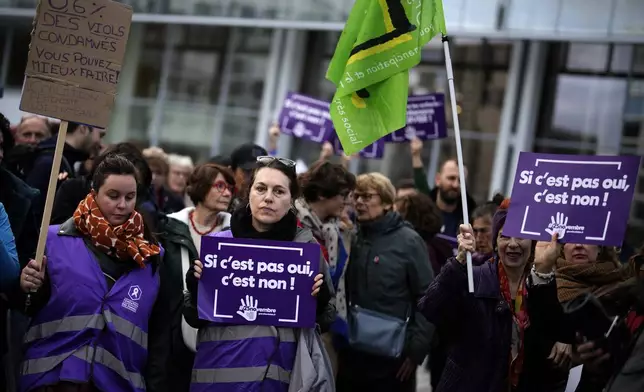 People gather to take part in a protest against sexual violence, in Paris, France, Saturday, Oct. 19, 2024. (AP Photo/Christophe Ena)