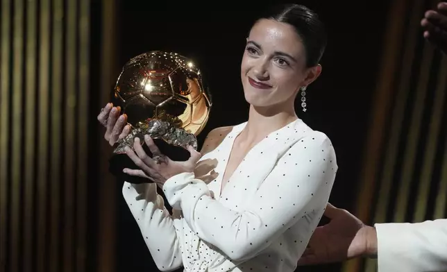 Barcelona's Aitana Bonmati receives the 2024 Women's Ballon d'Or award during the 68th Ballon d'Or (Golden Ball) award ceremony at Theatre du Chatelet in Paris, Monday, Oct. 28, 2024. (AP Photo/Michel Euler)