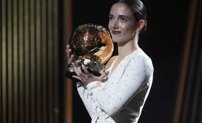 Barcelona's Aitana Bonmati, receives the 2024 Women's Ballon d'Or award during the 68th Ballon d'Or (Golden Ball) award ceremony at Theatre du Chatelet in Paris, Monday, Oct. 28, 2024. (AP Photo/Michel Euler)