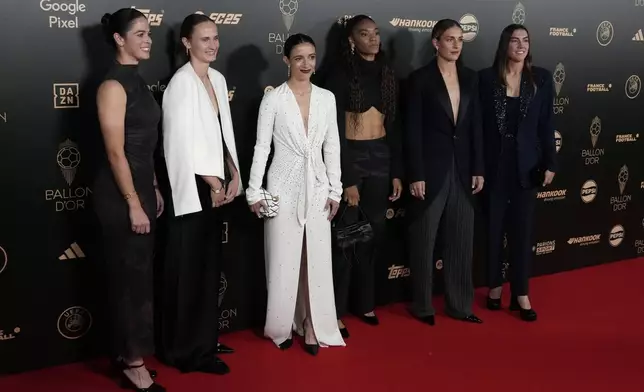 FC Barcelona women team players from left, Marta Torrejon, Caroline Graham Hansen , Aitana Bonmati, Salma Paralluelo, Alexia Putellas, Patri Guijarro, arrive for the 68th Ballon d'Or (Golden Ball) award ceremony at Theatre du Chatelet in Paris, Monday, Oct. 28, 2024. (AP Photo/Michel Euler)