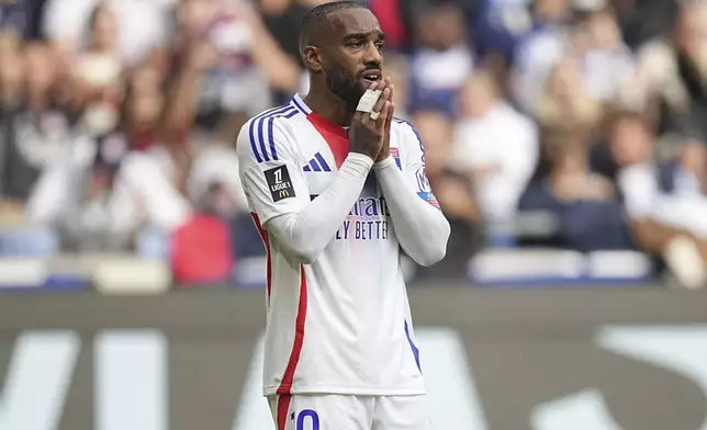 Lyon's Alexandre Lacazette reacts during the French League One soccer match between Lyon and FC Nantes at the Groupama stadium in Decines, outside Lyon, France, Sunday, Oct. 6, 2024. (AP Photo/Laurent Cipriani)