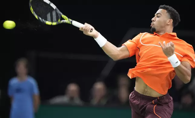 France's Arthur Fils slams a forehand to Jan-Lennard Struff of Germany during their second round match of the Paris Masters tennis tournament, Wednesday, Oct. 30, 2024 in Paris. (AP Photo/Michel Euler)
