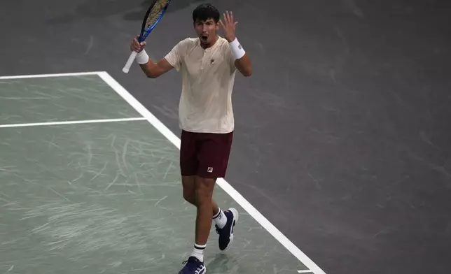 Alexei Popyrin, of Australia, reacts after winning a point as he plays Russia's Daniil Medvedev during their second round match of the Paris Masters tennis tournament, Wednesday, Oct. 30, 2024 in Paris. (AP Photo/Michel Euler)