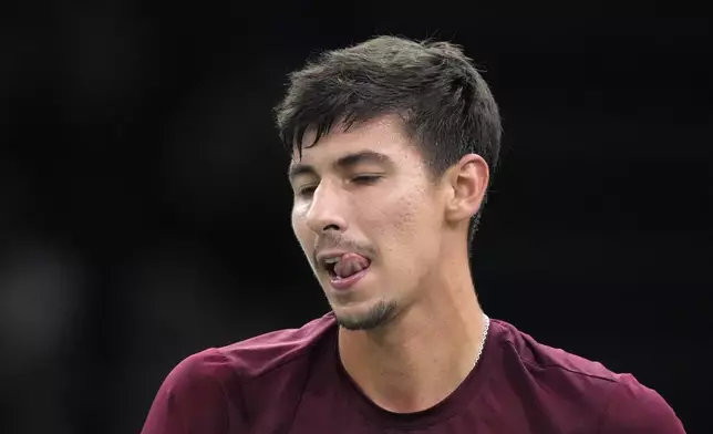 Alexei Popyrin, of Australia, reacts after losing a point to Russia's Daniil Medvedev during their second round match of the Paris Masters tennis tournament, Wednesday, Oct. 30, 2024 in Paris. (AP Photo/Michel Euler)
