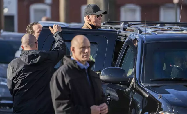 FILE - Surrounded by Secret Service agents, President Joe Biden steps into a vehicle in Wilmington, Del., Monday, Dec. 18, 2023. (AP Photo/Manuel Balce Ceneta, File)