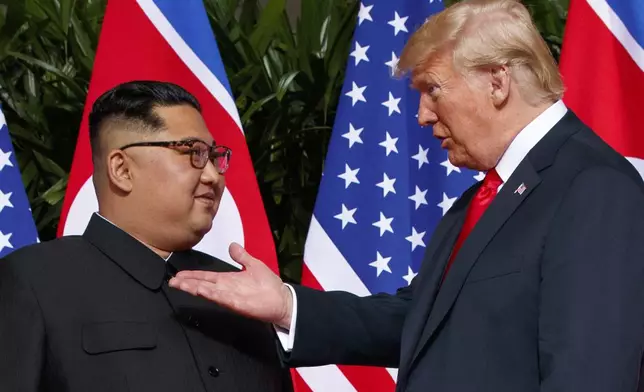 FILE - U.S. President Donald Trump, right, meets with North Korean leader Kim Jong Un on Sentosa Island in Singapore, on June 12, 2018. (AP Photo/Evan Vucci, File)