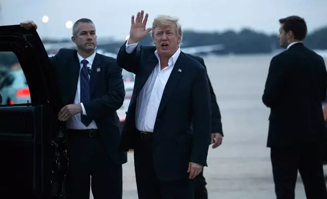 FILE - U.S. President Donald Trump yells to reporters after arriving at Andrews Air Force Base after a summit with North Korean leader Kim Jong Un in Singapore, Wednesday, June 13, 2018, in Andrews Air Force Base, Me. (AP Photo/Evan Vucci, File)