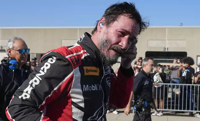 Keanu Reeves drives during the GR Cup Series auto race at Indianapolis Motor Speedway, Saturday, Oct. 5, 2024, in Indianapolis. (AP Photo/Darron Cummings)