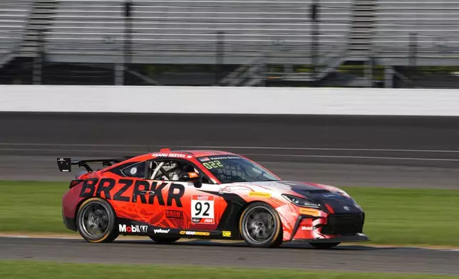 Keanu Reeves drives during the GR Cup Series auto race at Indianapolis Motor Speedway, Saturday, Oct. 5, 2024, in Indianapolis. (AP Photo/Darron Cummings)