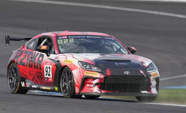 Keanu Reeves drives during the GR Cup Series auto race at Indianapolis Motor Speedway, Saturday, Oct. 5, 2024, in Indianapolis. (AP Photo/Darron Cummings)