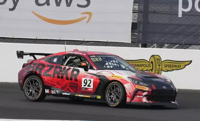 Keanu Reeves drives during the GR Cup Series auto race at Indianapolis Motor Speedway, Saturday, Oct. 5, 2024, in Indianapolis. (AP Photo/Darron Cummings)