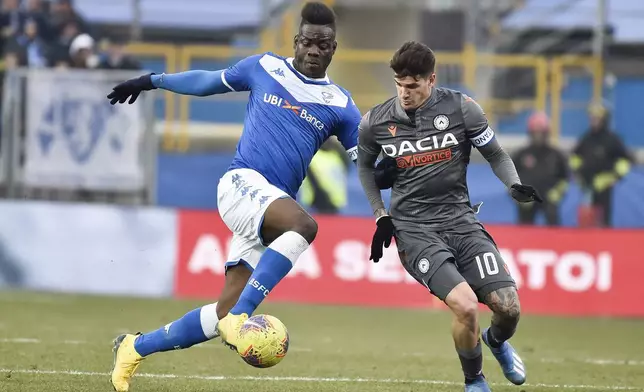 FILE - Udinese's Rodrigo De Paul, right, and Brescia's Mario Balotelli vie for the ball, during the Italian Serie A soccer match at the Mario Rigamonti stadium in Brescia, Italy, Sunday, Feb. 9, 2020. (Gianluca Checchi/LaPresse via AP, File)