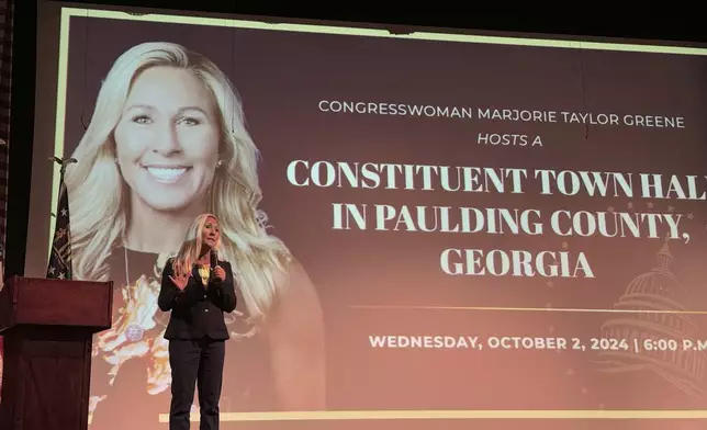 US Rep. Marjorie Taylor Greene speaks to supporters at a town hall in Dallas, Ga. on Oct. 2, 2024. (AP Photo/Charlotte Kramon)