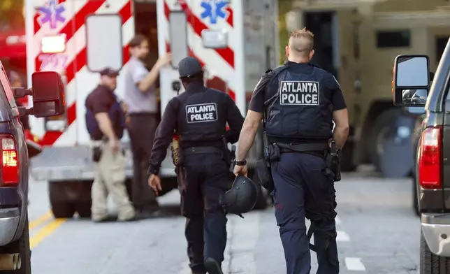 Police were present outside the Four Seasons Hotel after gunshots were reported on 14th Street in Midtown Atlanta, where a suspect was taken into custody Tuesday, Oct. 29, 2024 (Miguel Martinez/Atlanta Journal-Constitution via AP)