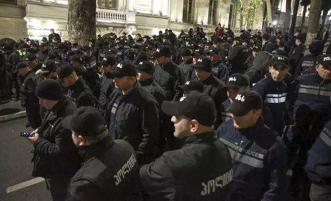 Police stand ready during an opposition protest against the results of the parliamentary election in Tbilisi, Georgia, on Monday, Oct. 28, 2024. (AP Photo/Zurab Tsertsvadze)