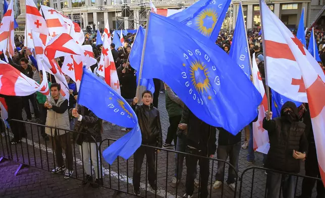 Supporters of the ruling Georgian Dream party attend a rally in the center of Tbilisi, Georgia, Wednesday, Oct. 23, 2024. (AP Photo/Shakh Aivazov)