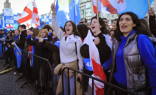 Supporters of the ruling Georgian Dream party attend a rally in the center of Tbilisi, Georgia, Wednesday, Oct. 23, 2024. (AP Photo/Shakh Aivazov)