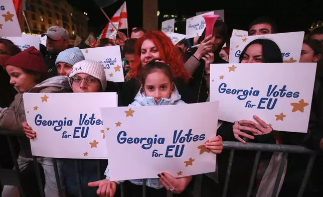 Demonstrators attend an opposition rally ahead upcoming next week parliamentary election in Tbilisi, Georgia, Sunday, Oct. 20, 2024. (AP Photo/Zurab Tsertsvadze)