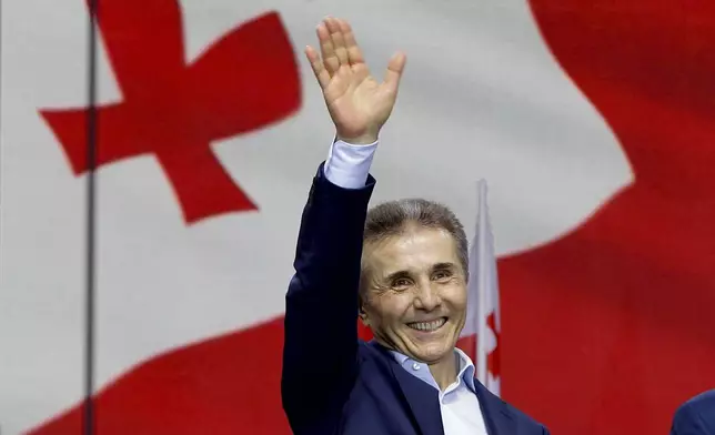 FILE - Billionaire Bidzina Ivanishvili, leader of the created by him the Georgian Dream party greets demonstrators during a rally in Tbilisi, Georgia, on April 29, 2024. (AP Photo/Shakh Aivazov, File)