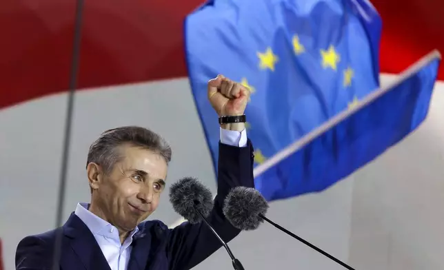 FILE - Billionaire Bidzina Ivanishvili, leader of the created by him the Georgian Dream party gestures greeting demonstrators during a rally in Tbilisi, Georgia, on April 29, 2024. (AP Photo/Shakh Aivazov, File)