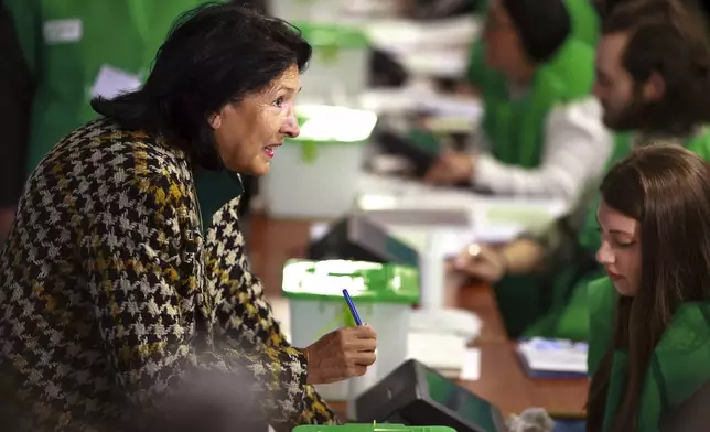 Georgian President Salome Zourabichvili, gets her ballot at a polling station during the parliamentary election in Tbilisi, Georgia, Saturday, Oct. 26, 2024. (AP Photo/Shakh Aivazov)
