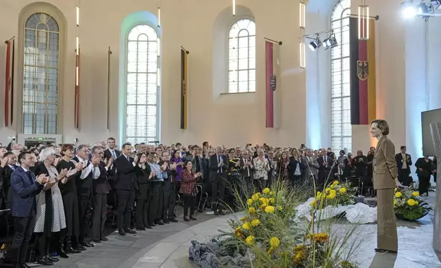 American journalist and historian Anne Applebaum gets standing ovations after she was awarded the Peace Prize of the German Publishers and Booksellers Association during a ceremony at the St. Paul's Church in Frankfurt, Germany, Sunday, Oct. 20, 2024.(AP Photo/Martin Meissner, Pool)