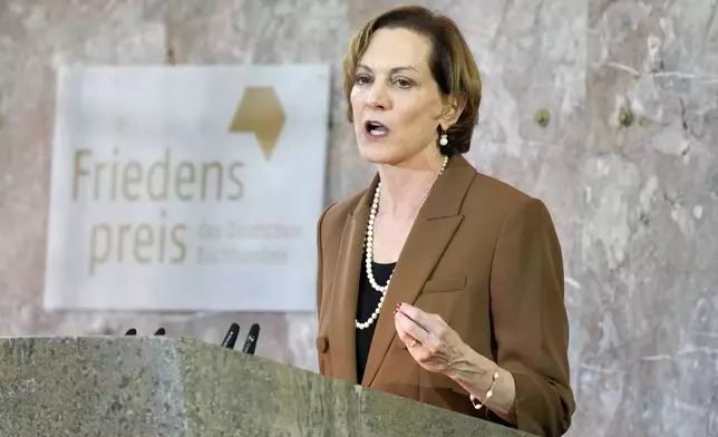 American journalist and historian Anne Applebaum delivers a speech after she was awarded the Peace Prize of the German Publishers and Booksellers Association during a ceremony at the St. Paul's Church in Frankfurt, Germany, Sunday, Oct. 20, 2024.(AP Photo/Martin Meissner, Pool)