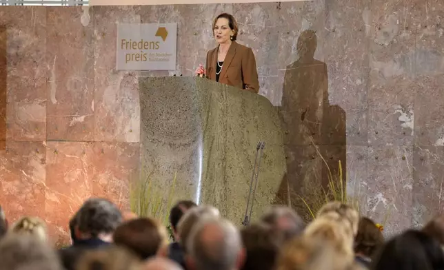 American journalist and historian Anne Applebaumholds a speech afters was awarded the Peace Prize of the German Publishers and Booksellers Association during a ceremony at the St. Paul's Church in Frankfurt, Germany, Sunday, Oct. 20, 2024.(AP Photo/Martin Meissner, Pool)