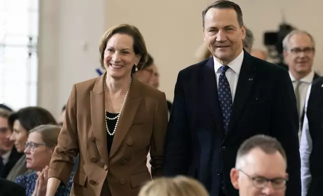 American journalist and historian Anne Applebaum arrives with her husband Poland's Foreign Minister Radosław Sikorski at the Peace Prize of the German Book Trade ceremony for Anne Applebaum at the St. Paul's Church in Frankfurt, Germany, Sunday, Oct. 20, 2024.(AP Photo/Martin Meissner, Pool)