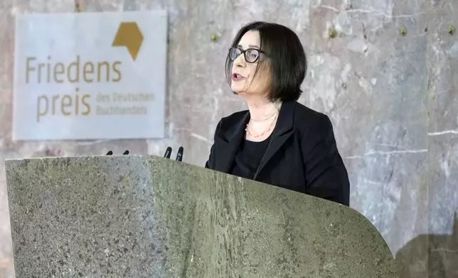 Russian Memorial founder Irina Scherbakowa delivers the laudatio for American journalist and historian Anne Applebaum who is awarded the Peace Prize of the German Publishers and Booksellers Association during a ceremony at the St. Paul's Church in Frankfurt, Germany, Sunday, Oct. 20, 2024.(AP Photo/Martin Meissner, Pool)