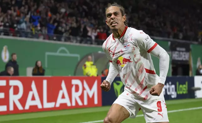 RB Leipzig's Yussuf Poulsen celebrates after his goal against St. Pauli in a German Cup soccer match in Leipzig, Germany Tuesday, Oct. 29, 2024. (Hendrik Schmidtdpa via AP)