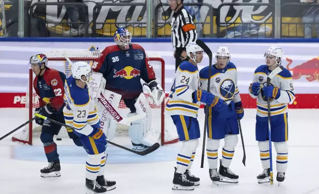 Buffalo Sabres NHL hockey players celebrate a goal during an ice hockey match against Red Bull Munich in Munich, Germany, Friday, Sept. 27, 2024.(Sven Hoppe/dpa via AP)