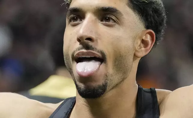 Frankfurt's Omar Marmoush celebrates after scoring his side's third goal during the German Bundesliga soccer match between Eintracht Frankfurt and Bayern Munich in Frankfurt, Germany, Sunday, Oct. 6, 2024. (AP Photo/Michael Probst)