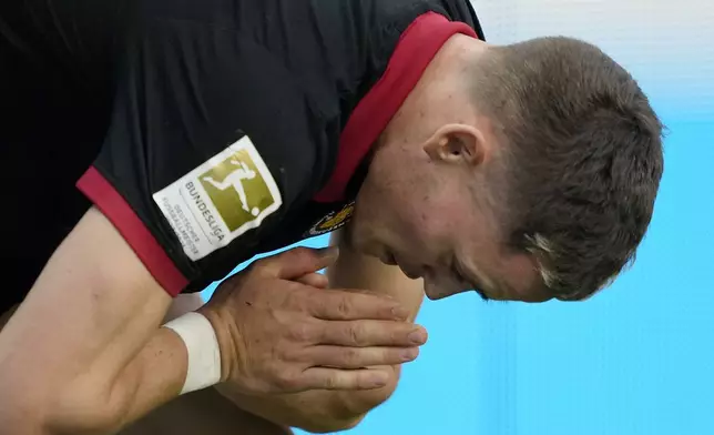 Leverkusen's Florian Wirtz reacts disappointed after not winning the German Bundesliga soccer match between Bayer Leverkusen and Holstein Kiel at the BayArena in Leverkusen, Germany, Saturday, Oct. 5, 2024. (AP Photo/Martin Meissner)