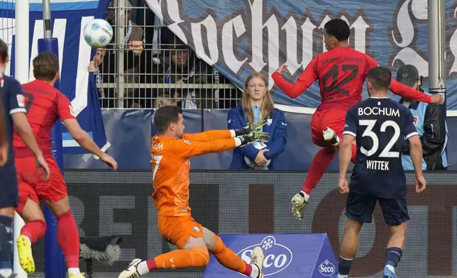 Bayern's Jamal Musiala scores a header during the German Bundesliga soccer match between VfL Bochum and Bayern Munich in Bochum, Germany, Sunday, Oct. 27, 2024. (AP Photo/Martin Meissner)