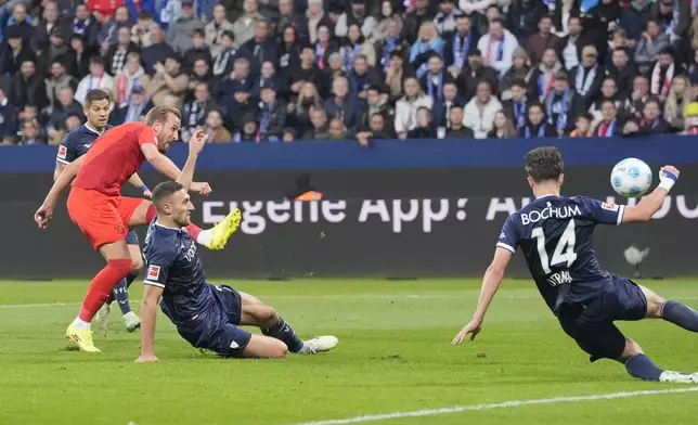 Bayern's Harry Kane scores during the German Bundesliga soccer match between VfL Bochum and Bayern Munich in Bochum, Germany, Sunday, Oct. 27, 2024. (AP Photo/Martin Meissner)