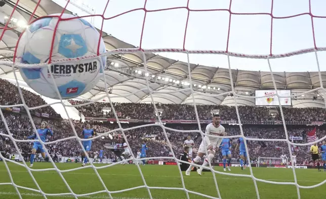 Stuttgart's Deniz Undav scores his side's opening goal during the German Bundesliga soccer match between VfB Stuttgart and Holstein Kiel at the MHPArena in Stuttgart, Germany, Saturday, Oct. 26, 2024. (Marijan Murat/dpa via AP)