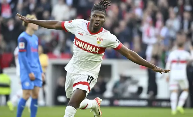 Stuttgart's El Bilal Toure celebrates after scoring his side's second goal during the German Bundesliga soccer match between VfB Stuttgart and Holstein Kiel at the MHPArena in Stuttgart, Germany, Saturday, Oct. 26, 2024. (Marijan Murat/dpa via AP)