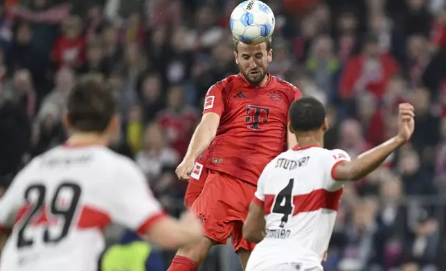 Munich's Harry Kane heads the ball against Stuttgart during a German Bundesliga soccer match between FC Bayern Munich and VfB Stuttgart, in Munich, Germany, Saturday, Oct. 19, 2024. (Sven Hoppe/dpa via AP)