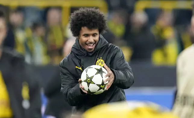 Dortmund's Karim Adeyemi keeps the ball after scoring three goals at the Champions League opening phase soccer match between Borussia Dortmund and Celtic FC at the BVB Stadion in Dortmund, Germany, Tuesday, Oct. 1, 2024. Dortmund won 7-1. (AP Photo/Martin Meissner)