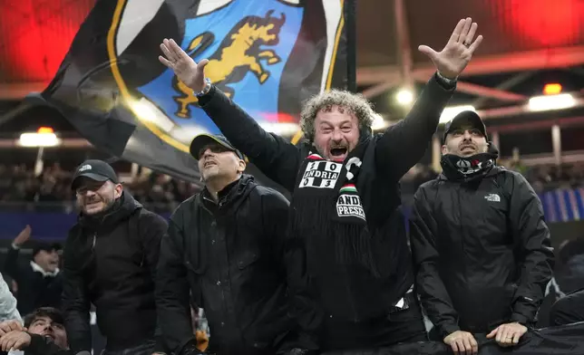 Juventus fans celebrate after the UEFA Champions League opening phase soccer match between Leipzig and Juventus in Leipzig, Germany, Wednesday, Oct. 2, 2024.(AP Photo/Ebrahim Noroozi)