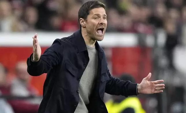 Leverkusen's head coach Xabi Alonso reacts during the German Soccer Cup match between Bayer Leverkusen and SV Elversberg at the BayArena in Leverkusen, Germany, Tuesday, Oct. 29, 2024. (AP Photo/Martin Meissner)