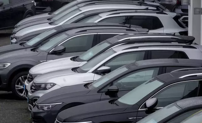 Volkswagen cars of a car dealer are parked in Neu-Anspach near Frankfurt, Germany, Wednesday, Oct. 30, 2024. (AP Photo/Michael Probst)