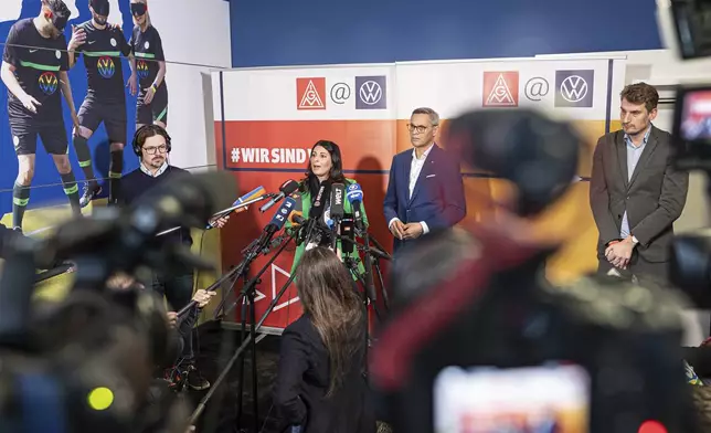Daniela Cavallo, Chairwoman of the General and Group Works Council of Volkswagen AG, and Thorsten Gröger, District Manager of IG Metall, makes press statements before the start of the second collective bargaining negotiations between Volkswagen and IG Metall, in Wolfsburg, Germany, Wednesday, Oct. 30, 2024. (Moritz Frankenberg/dpa via AP)