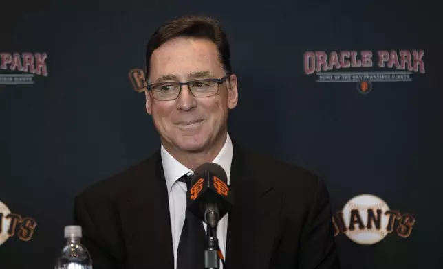 San Francisco Giants manager Bob Melvin listens during a press conference introducing former catcher Buster Posey as the team's president of baseball operations, Tuesday. Oct. 1, 2024, in San Francisco. (Stephen Lam/San Francisco Chronicle via AP)