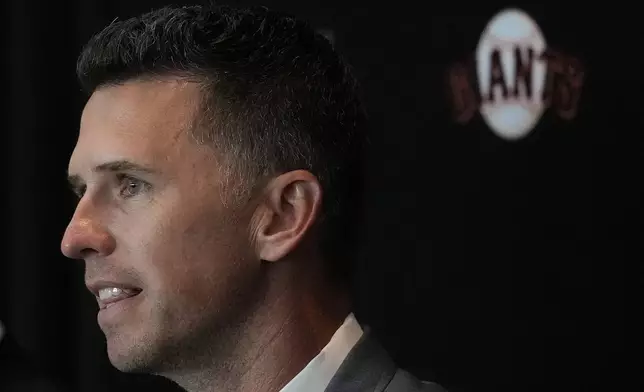 San Francisco Giants president of baseball operations Buster Posey speaks during a news conference in San Francisco, Tuesday, Oct. 1, 2024. (AP Photo/Jeff Chiu)