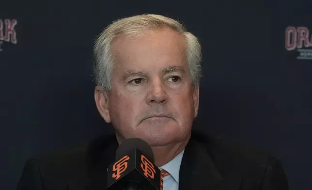 San Francisco Giants baseball team chairman Greg Johnson listens to speakers during news conference in San Francisco, Tuesday, Oct. 1, 2024. (AP Photo/Jeff Chiu)