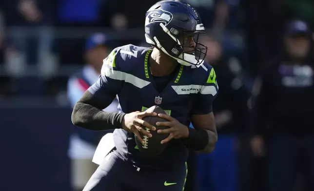 Seattle Seahawks quarterback Geno Smith (7) looks to pass during the second half of an NFL football game against the New York Giants, Sunday, Oct. 6, 2024, in Seattle. (AP Photo/Lindsey Wasson)