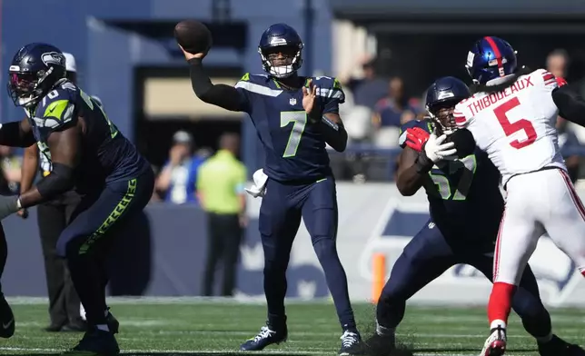 Seattle Seahawks quarterback Geno Smith (7) passes during the first half of an NFL football game against the New York Giants, Sunday, Oct. 6, 2024, in Seattle. (AP Photo/Lindsey Wasson)